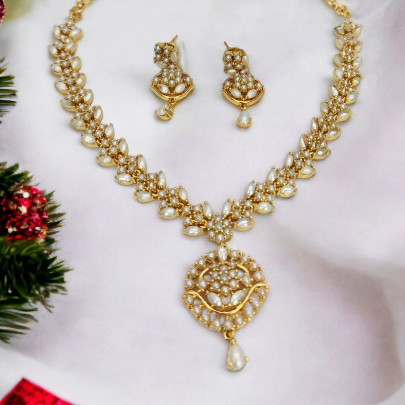Beautiful necklace set is crafted with a matte gold polish finish and –  Look Ethnic